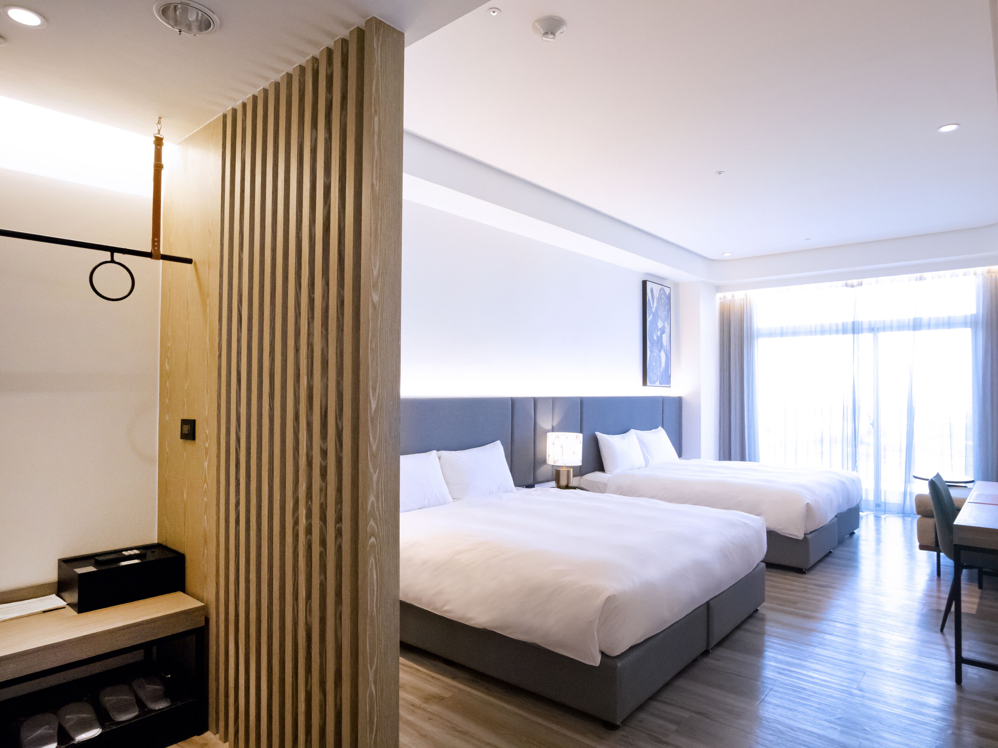 deluxe quadruple room, 1 bedroom | 1 bedroom, hypo-allergenic bedding, down duvets, in-room safe