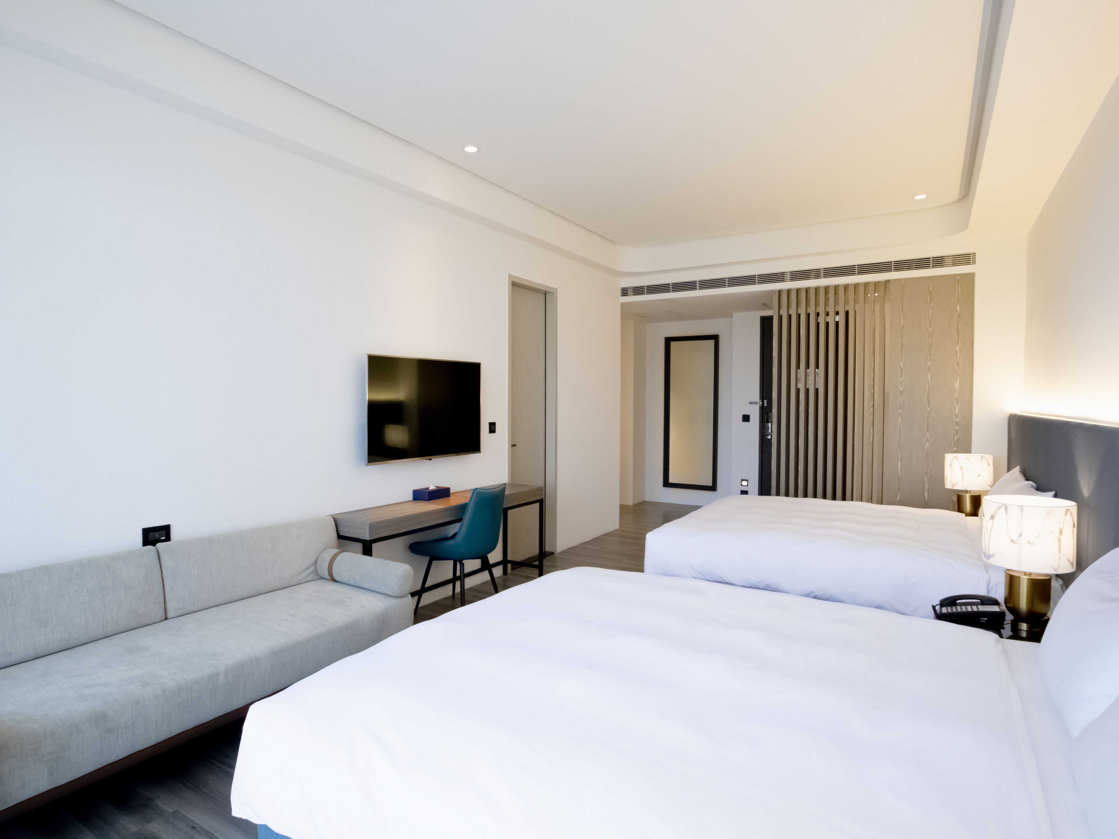 deluxe quadruple room, 1 bedroom | 1 bedroom, hypo-allergenic bedding, down duvets, in-room safe