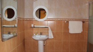 A bathroom with a sink, two mirrors, and a towel rack. - Ceamo Prestige Lodge (Makutano)