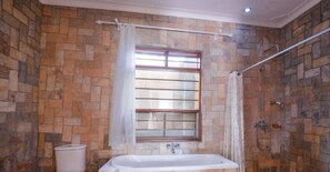 Shower, rainfall showerhead, towels, soap