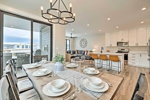 A modern kitchen with white cabinets, a microwave, and a sink. - Newly-Built Lakeside Gem w/ Community Perks! (Huntsville)