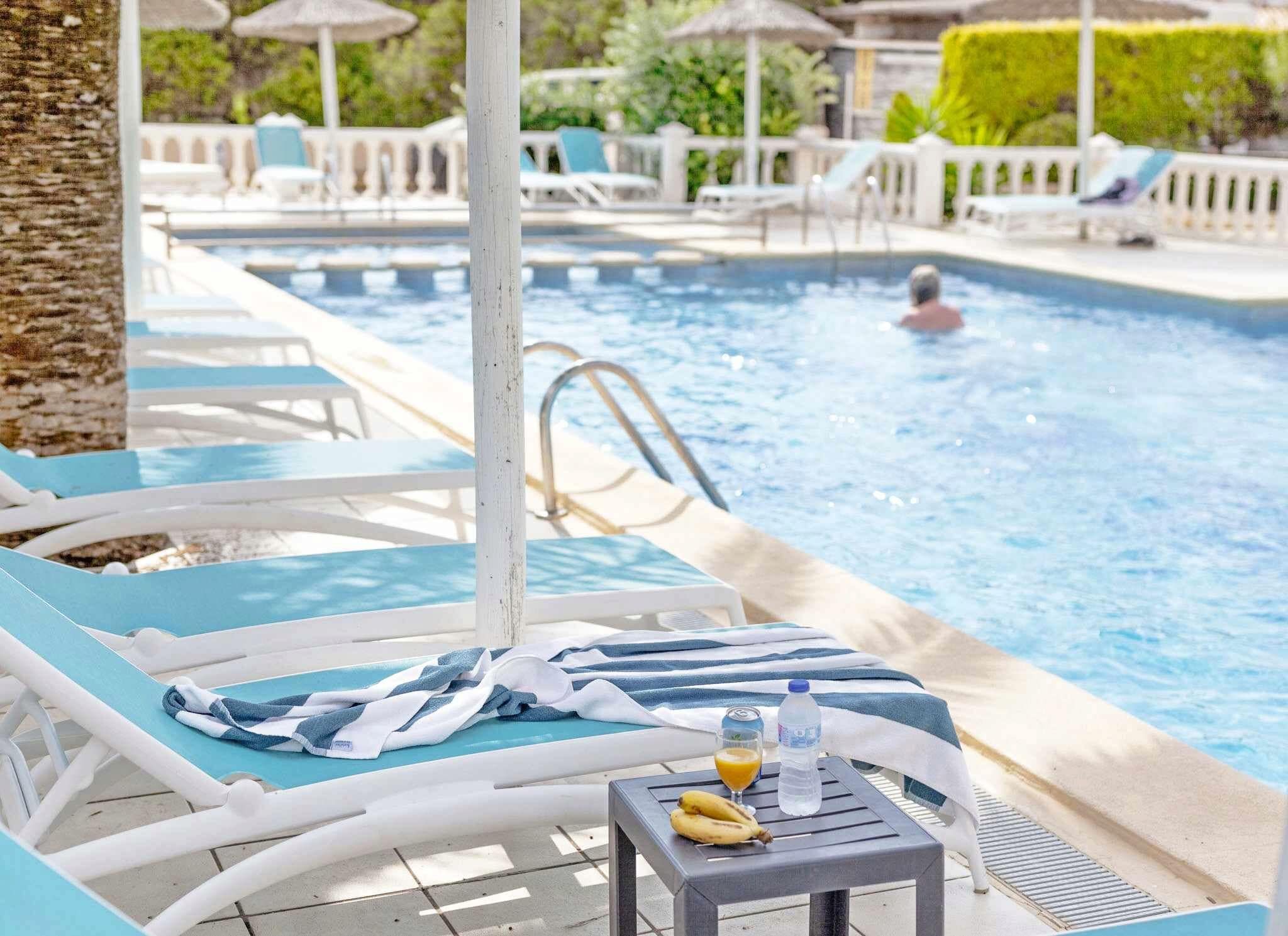 Seasonal outdoor pool, pool umbrellas, pool loungers