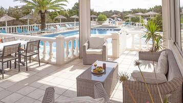 Seasonal outdoor pool, pool umbrellas, pool loungers