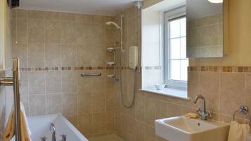 Bathtub, towels, soap, toilet paper