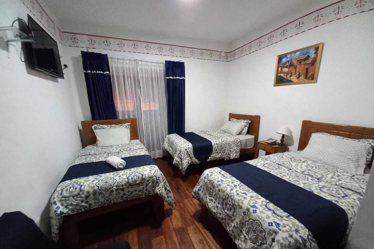 Habitación triple básica | Ropa de cama