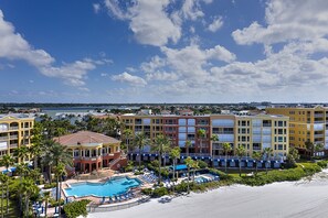 A resort with a swimming pool, beach, and multiple hotel buildings. - Escape to Paradise Found at The Tides Beach Club (Redington Beach)