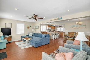 TV, books - Shell Cottage | East Side Assateague Channel Views w/ Decks, Outdoor Shower, Boat Parking & Pets (Chincoteague Island)