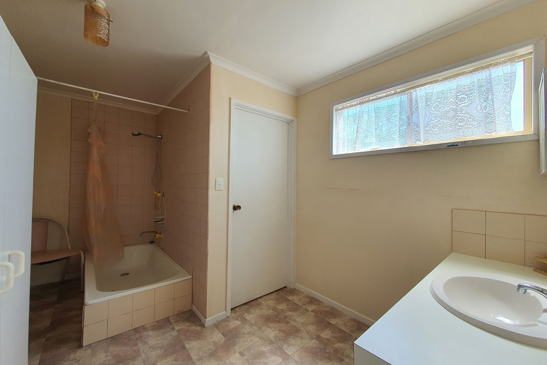 A bathroom with a bathtub, a shower, a toilet, and a sink.
