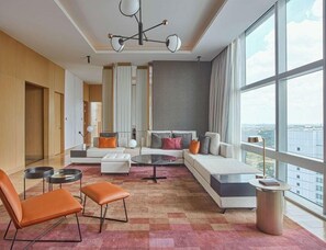 Swiss Prestige Suite, 1 King Bed | Living area | 55-inch flat-screen TV with cable channels, TV