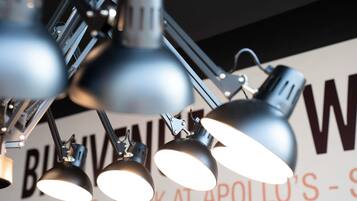 A ceiling-mounted lighting fixture with multiple adjustable arms and lamps.