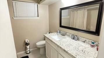 Combined shower/tub, hair dryer, towels, soap