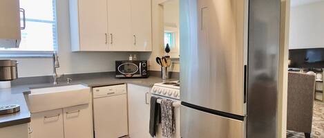 Fridge, coffee/tea maker, cookware/dishes/utensils