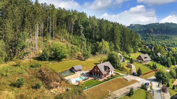 A rural area with houses surrounded by dense forests and hills. - Villa Pool Stupna Ksf095 (Vidochov)