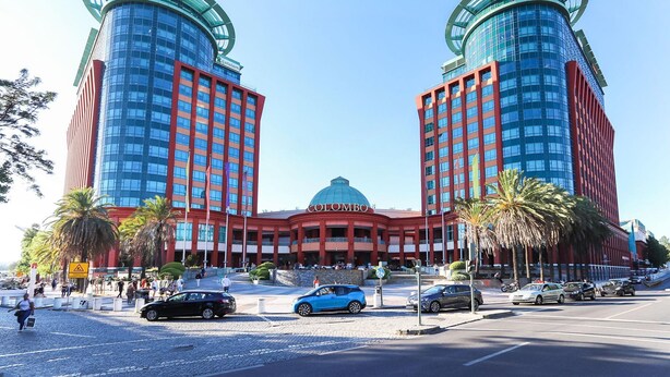 A large hotel with two prominent towers, a central dome, and a red facade. - Benfica Apartments III by Homing (Lisbon)