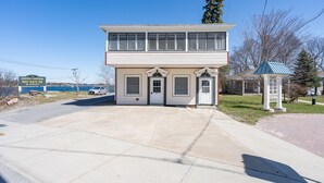 A two-story building with a flat roof, a small porch, and a sign indicating it's the Cornwall Brothers Museum.