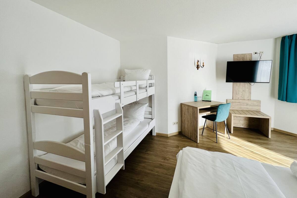 family quadruple room | hypo-allergenic bedding, desk, blackout curtains, iron/ironing board