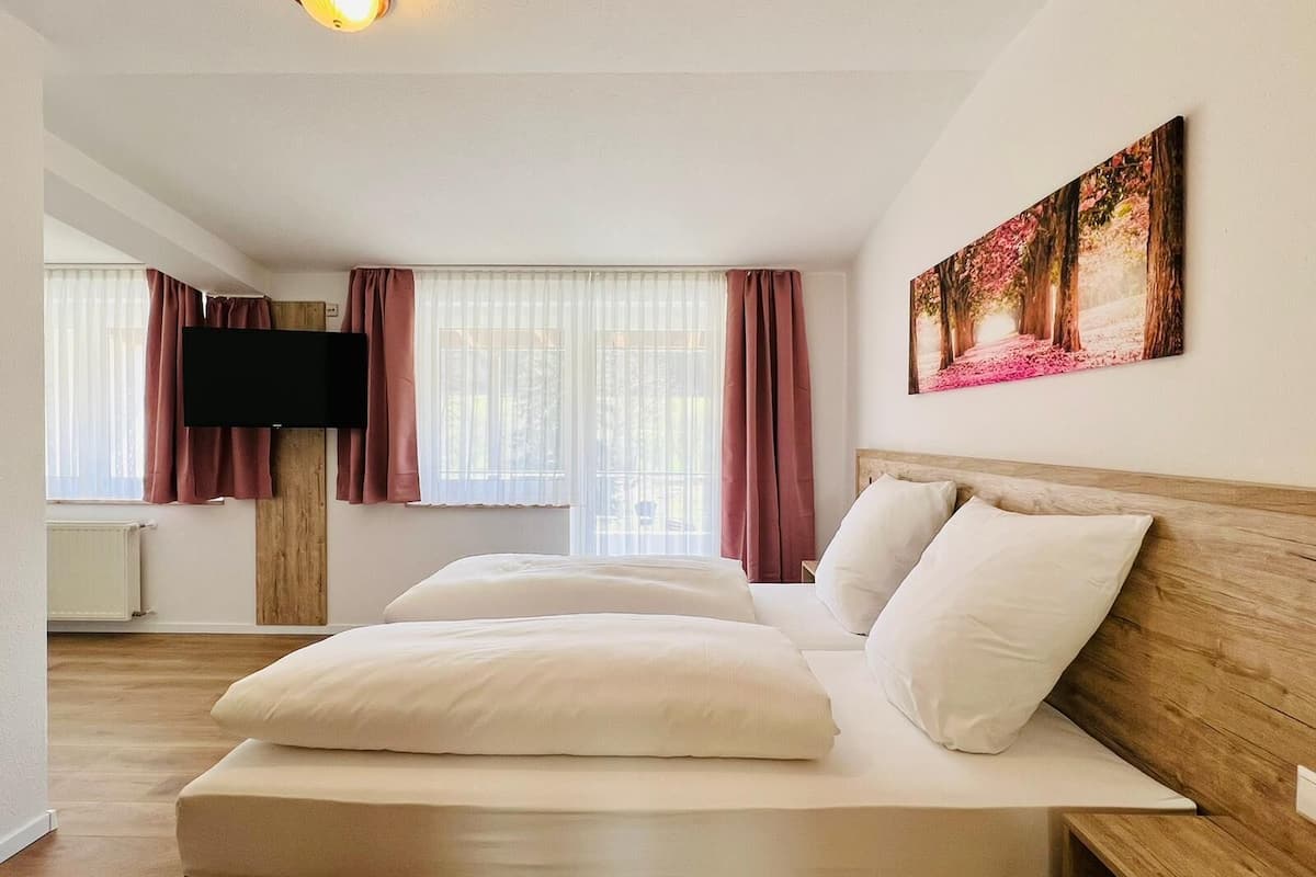 family quadruple room | hypo-allergenic bedding, desk, blackout curtains, iron/ironing board