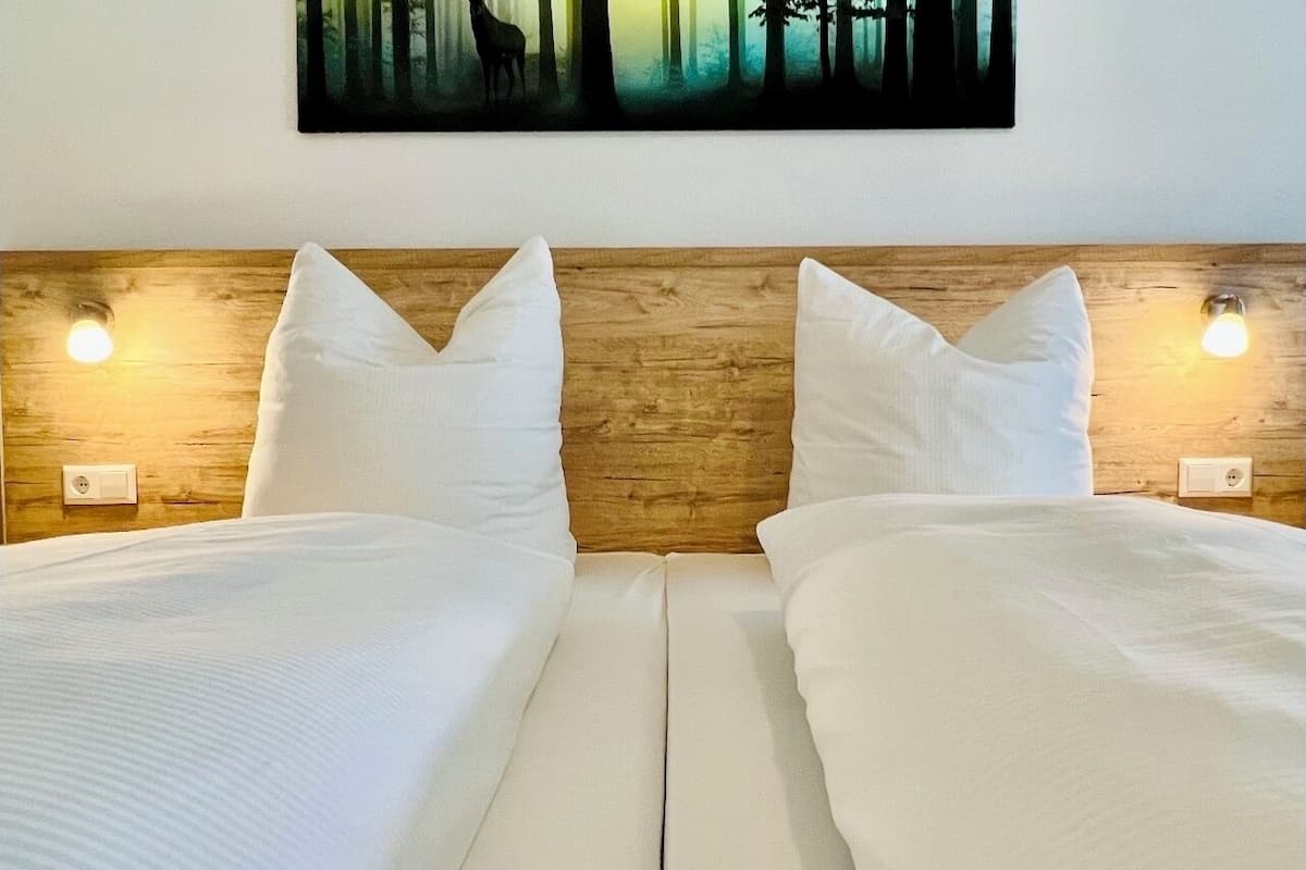 hypo-allergenic bedding, desk, blackout curtains, iron/ironing board