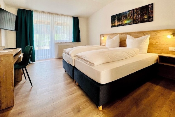 Hypo-allergenic bedding, desk, blackout drapes, iron/ironing board