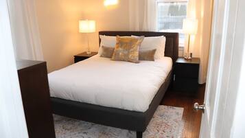 1 bedroom, desk, iron/ironing board, travel crib