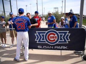 A baseball player in a blue jersey with the number 28 signing autographs at a booth. - Scottsdalestays Sleep 22 Multimillion Acre Resort-Big Pool, Spa-Best Area/Yard. (Scottsdale)