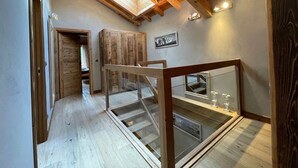 A wooden interior with a skylight, a staircase, and a framed picture on the wall. - Charming chalet in Les Praz de Chamonix near the Flégère's cable car (Chamonix-Mont-Blanc)