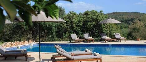 Outdoor pool, pool umbrellas, pool loungers