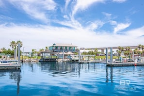 Enjoy waterfront views from the property's flat-roofed building, which offers a dock and mooring for a boat.