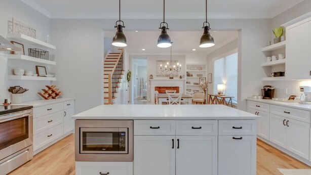 A modern kitchen with white cabinetry, a built-in oven, and pendant lighting. - Superstar Country Retreat - Historic Franklin Home (Franklin)