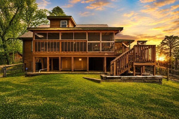 A two-story wooden house with a deck and a staircase. - Maple Top: Sweet Views, Sweeter Stays (Sevierville)