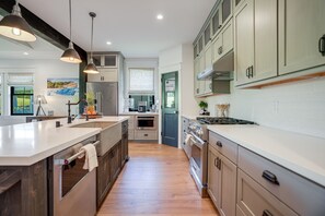 Fridge, microwave, oven, stovetop - Luxe retreat with hot tub and pool access, private W/D, grill, AC, & gas range (Koloa)