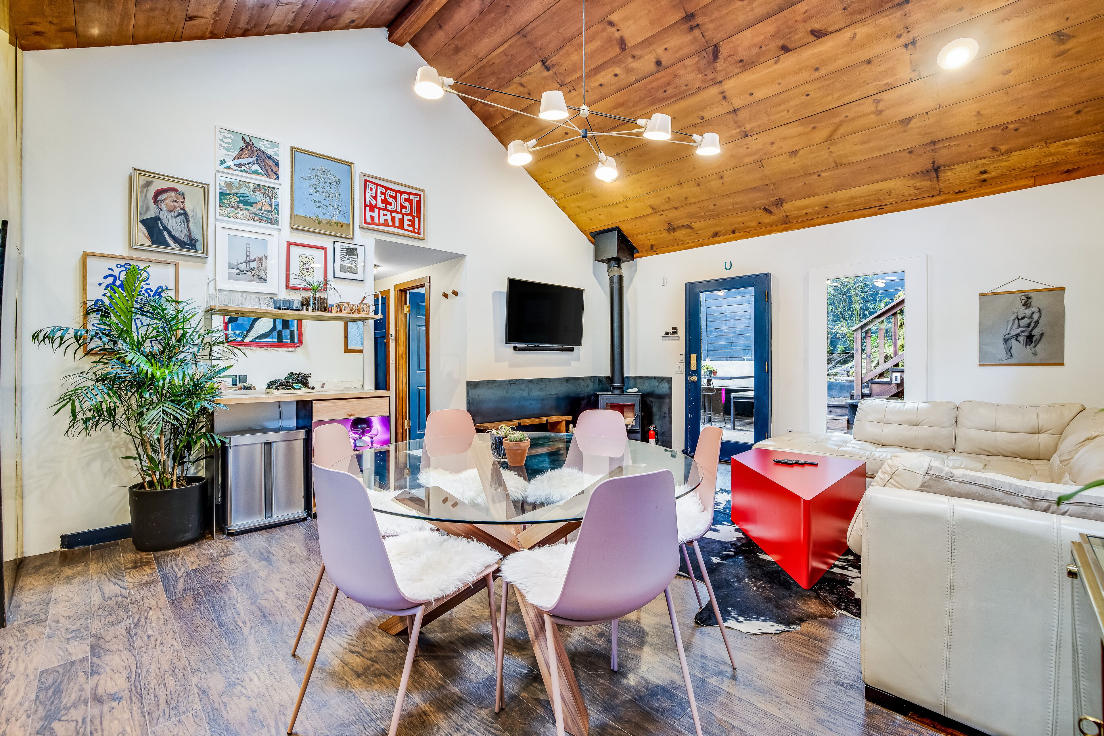 Artful dog-friendly home with enclosed yard, wood stove, grill, and patio