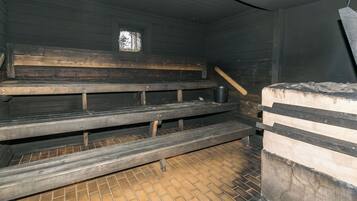 A room with wooden benches and a tiled floor.