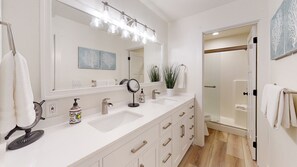 Combined shower/tub, hair dryer, towels, soap