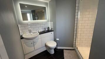 Bathtub, hair dryer, towels