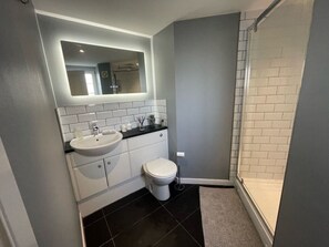 Bathtub, hair dryer, towels
