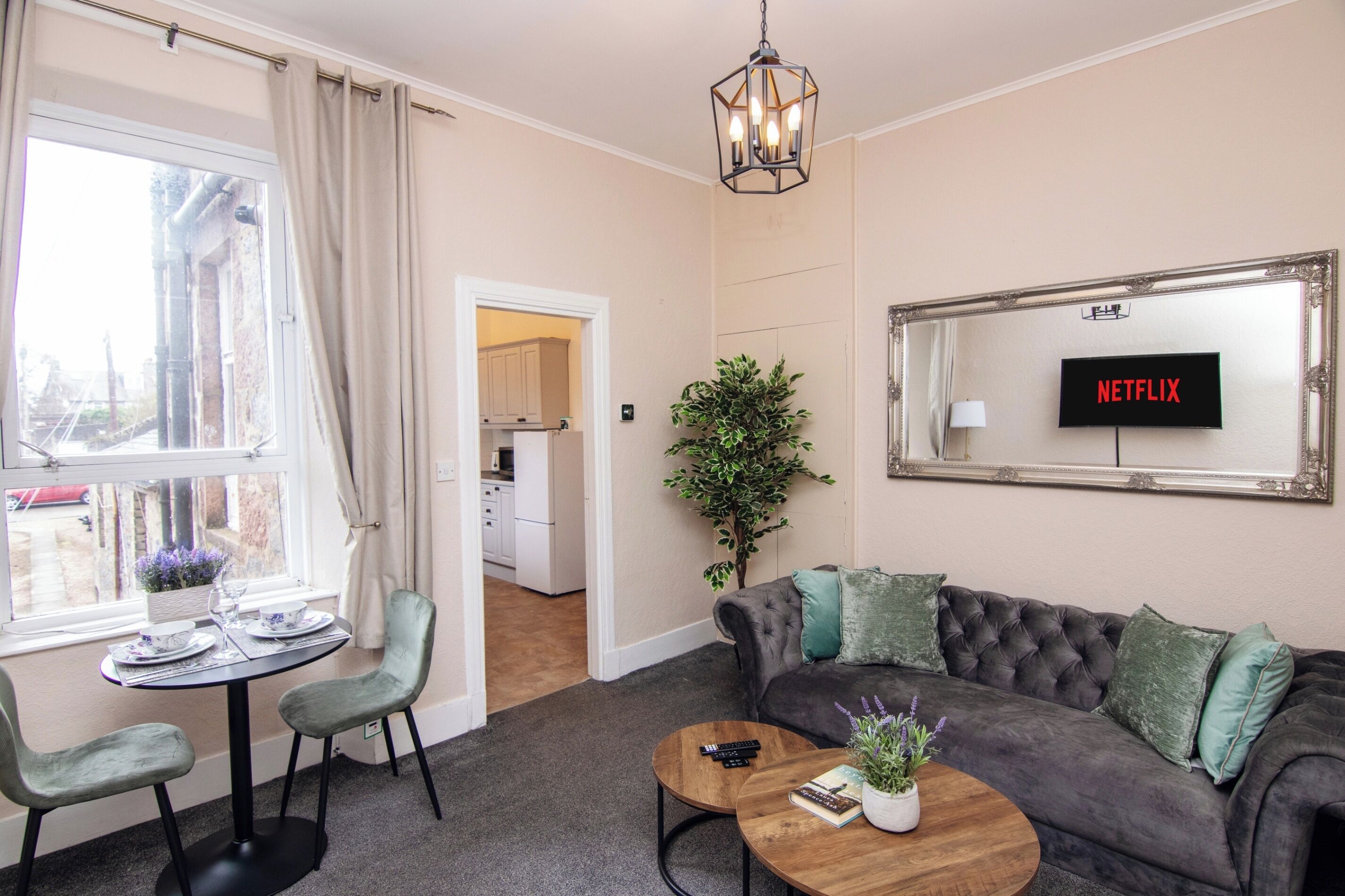 Spacious lounge with dining area and kitchen just steps away — ideal for longer stays and business travellers.