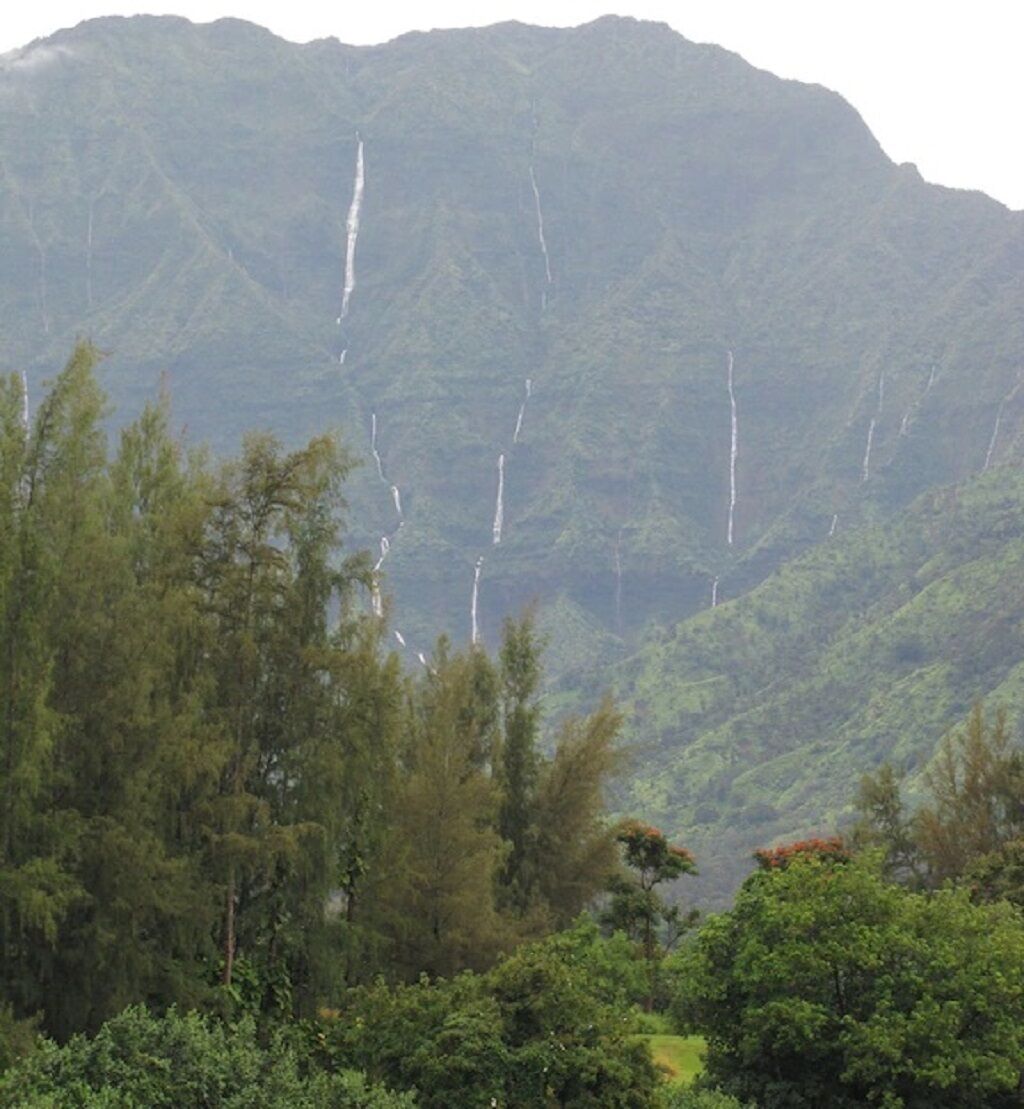 A mountainous landscape with a waterfall.