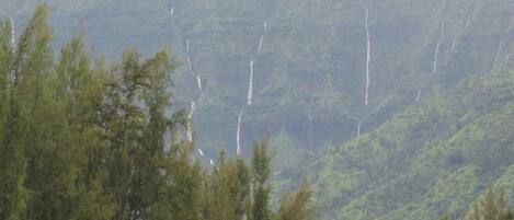 A mountainous landscape with a waterfall.