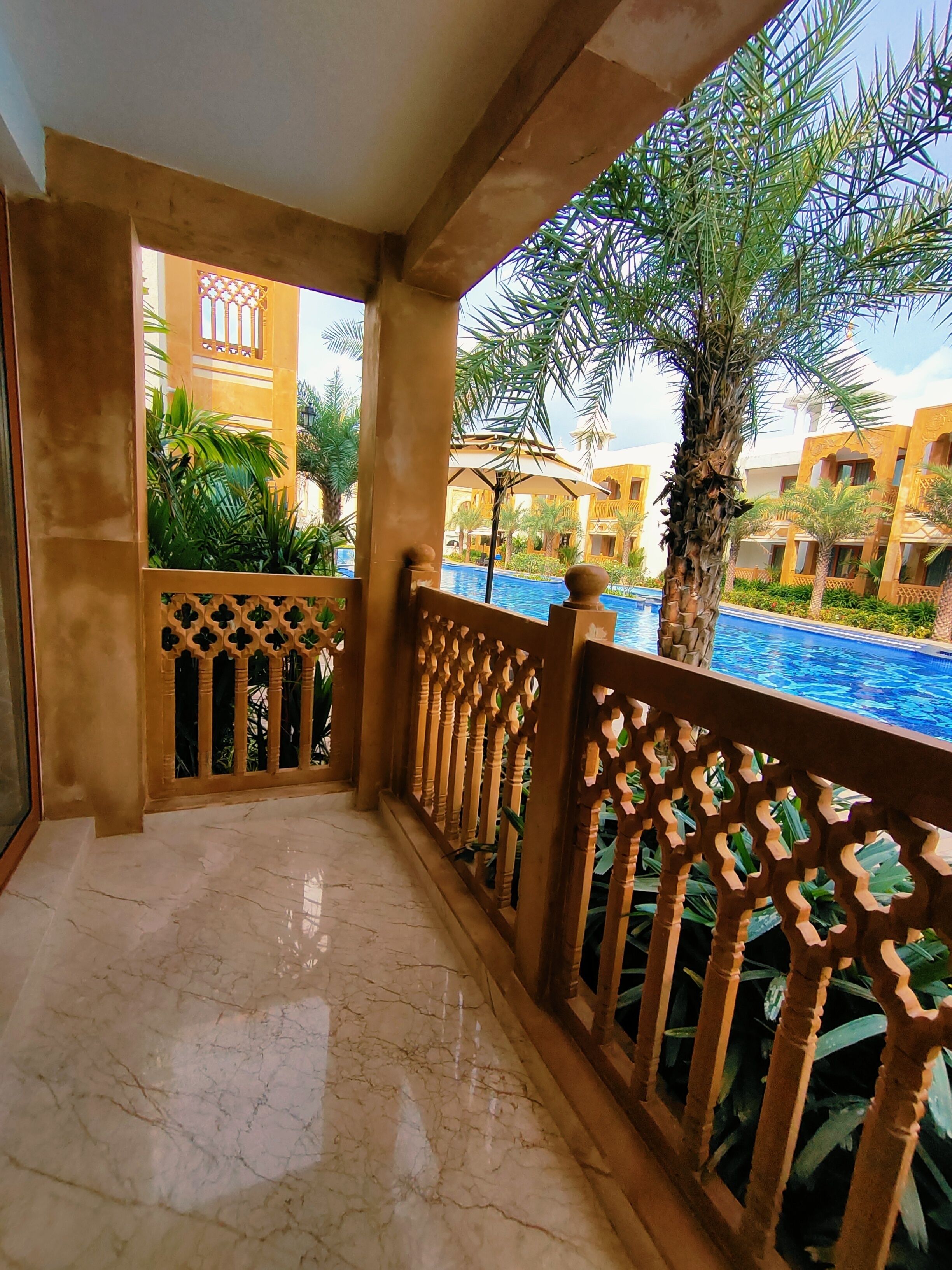 Premium King First Floor Pool Facing | Balcony