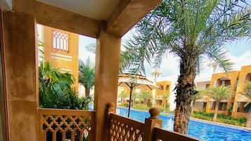 Premium King First Floor Pool Facing | Balcony