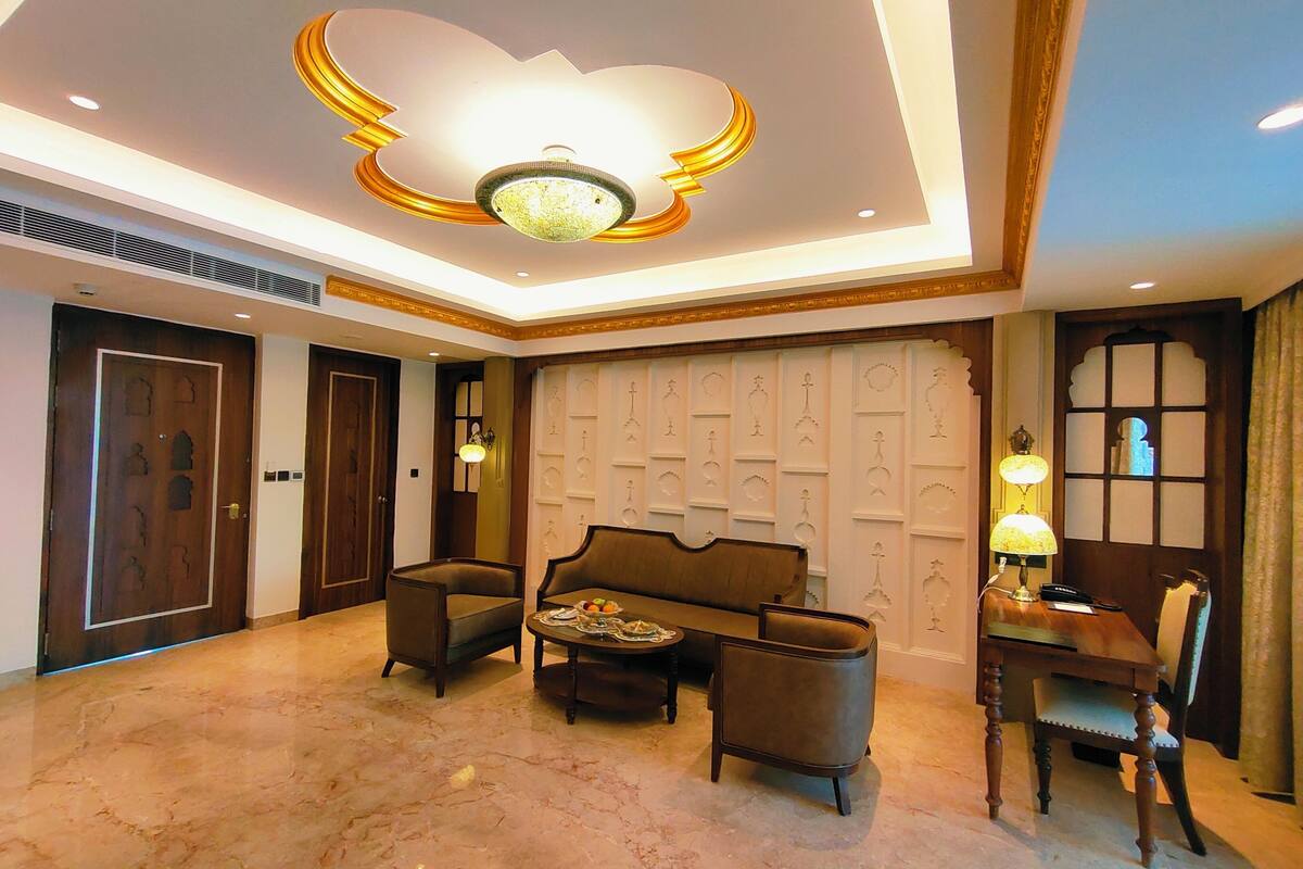 Executive Suite, 1 King Bed, Balcony, Pool View | Living area | 49-inch flat-screen TV with cable channels, TV, foosball