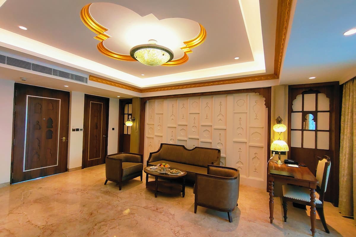 Executive Suite, 1 King Bed, Balcony, Pool View | Living area | 49-inch flat-screen TV with cable channels, TV, foosball