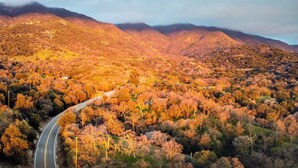 A mountainous landscape with a winding road.