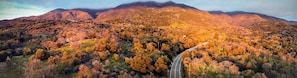 A mountainous landscape with a winding road.