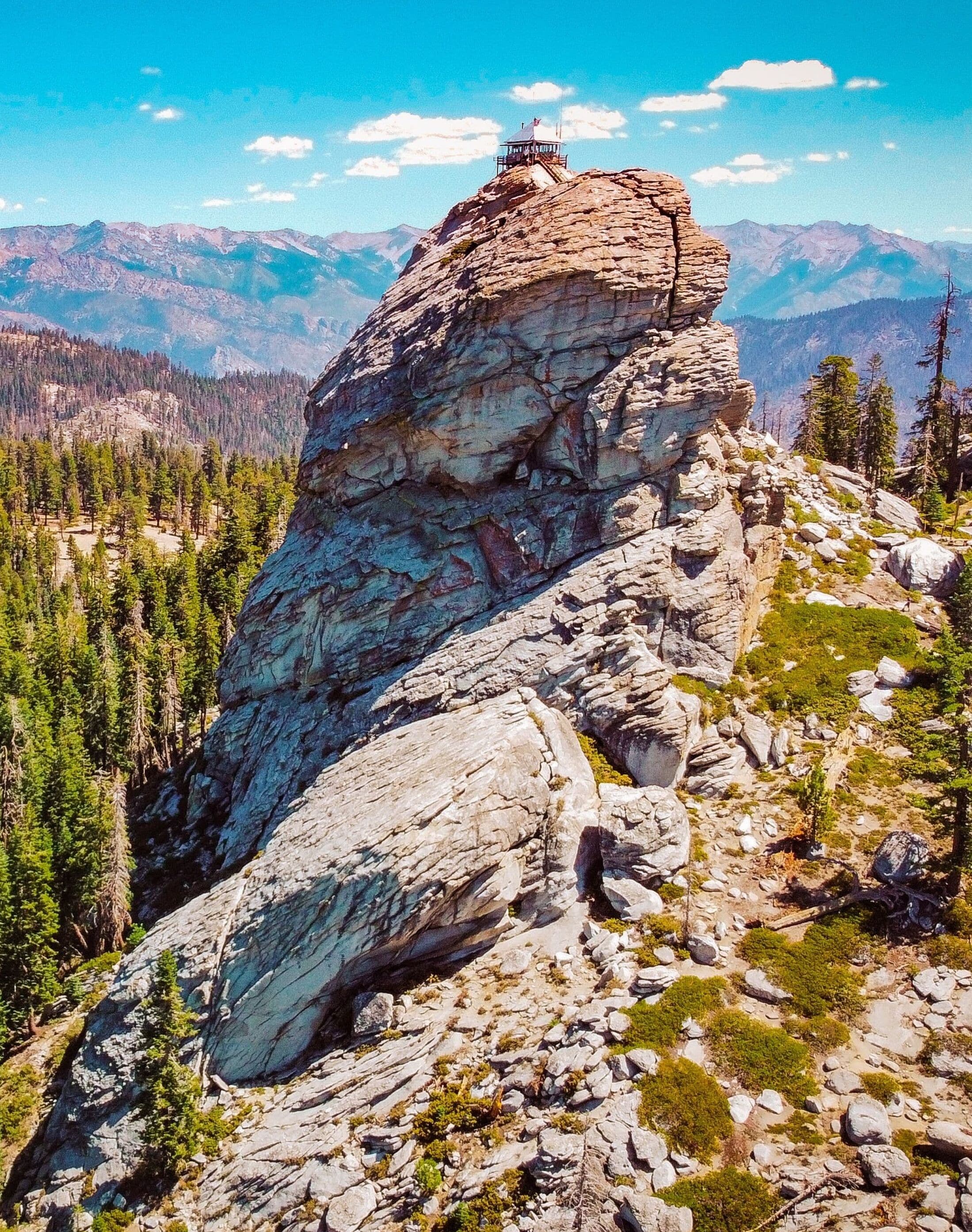 A rocky mountain peak with a small observation tower.