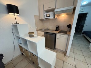 Fridge, microwave, stovetop, coffee/tea maker