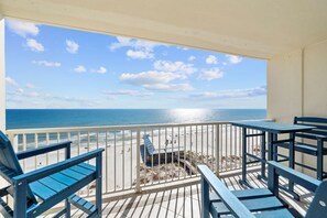 A balcony with a view of the ocean and beach. - Gulf Shores Beachfront Condo | Sleep 8 | Amazing View | Gulf-Front Pool & Dining (Gulf Shores)