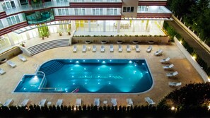 An indoor swimming pool with lounge chairs and a sun terrace. - Maria Palace-Hotel All inclusive (Sunny Beach)