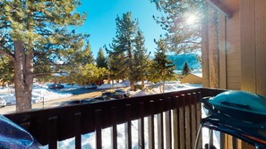 Enjoy breathtaking views of the surrounding landscape from this balcony.